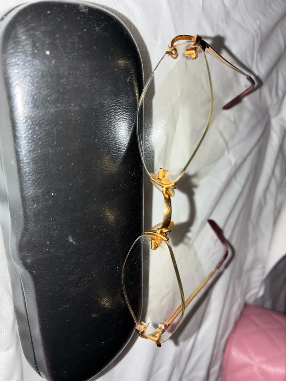 Cartier Gold Rimless Women's Glasses with Subtle Pink Temples